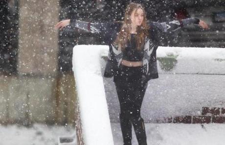 A snow-lover danced on a roofdeck in Newport, R.I. on Saturday.
